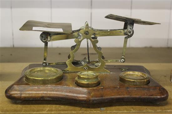 A set of oak postal scales with weights